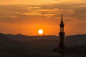 Free photo sunset with muslim mosque in foreground