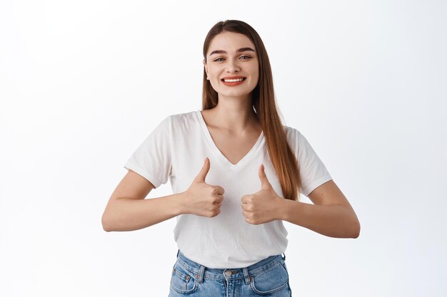 Super good promo. smiling beautiful lady shows thumbs up in approval, say yes, make praise gesture, excellent job, nice work or well done, satisfied with quality, white background