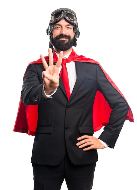 Free photo super hero businessman counting three