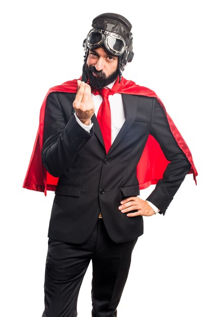 Super hero businessman doing a money gesture