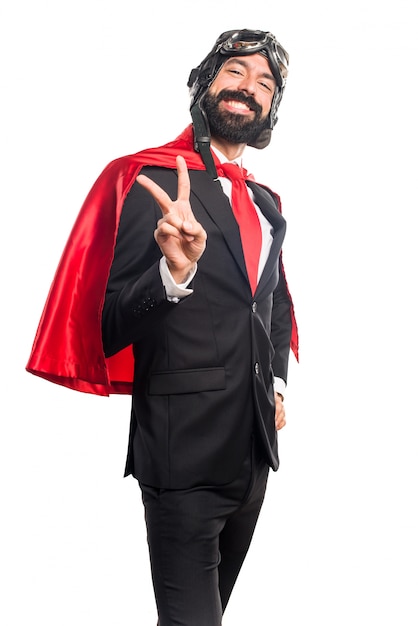 Free photo super hero businessman doing victory gesture