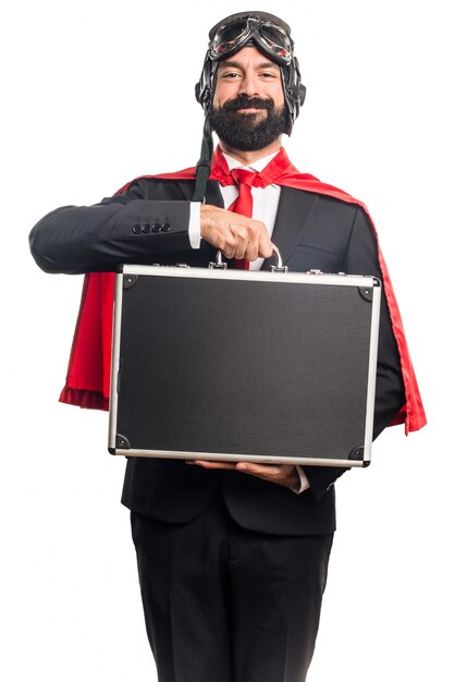 Super hero businessman holding a briefcase