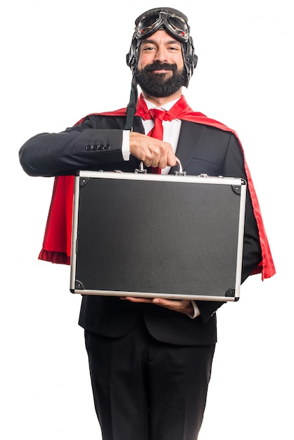 Super hero businessman holding a briefcase