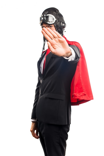 Free photo super hero businessman making stop sign