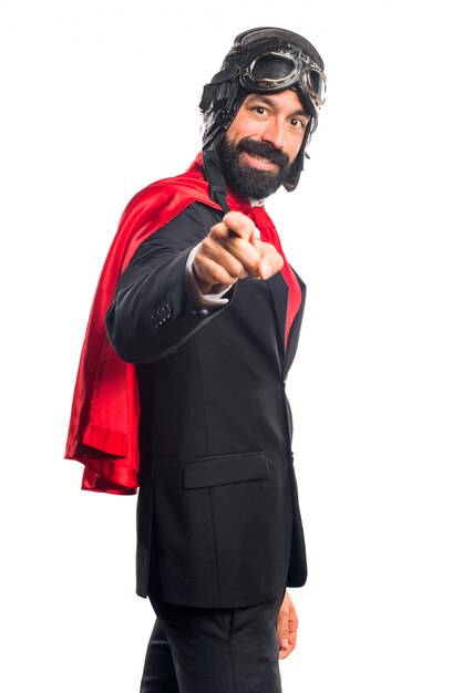 Super hero businessman pointing to the front