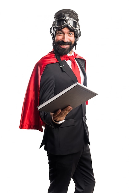 Super hero businessman reading book