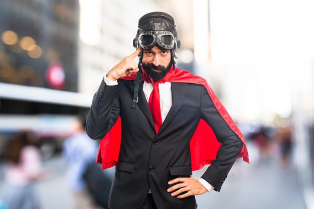 Super hero businessman thinking