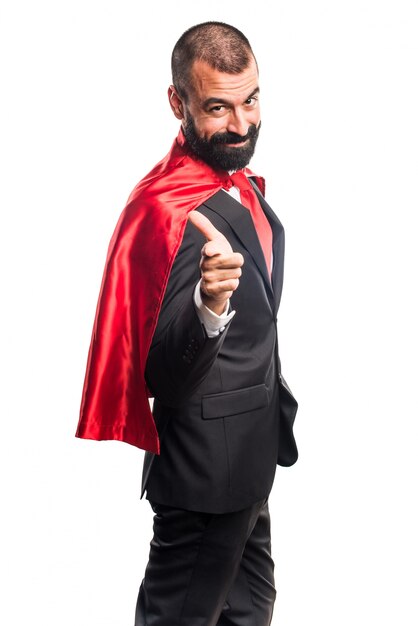 Super hero businessman with thumb up