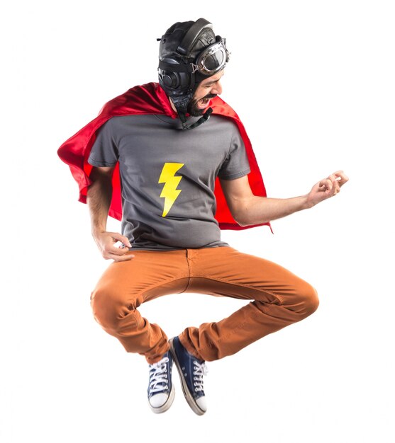 Superhero making guitar gesture