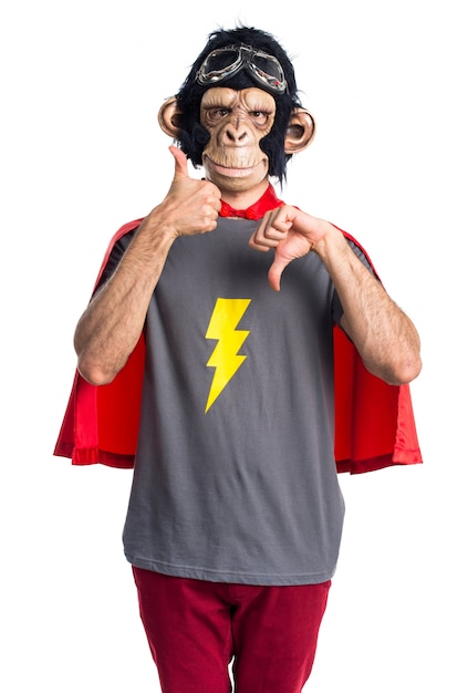 Superhero monkey man making good-bad sign