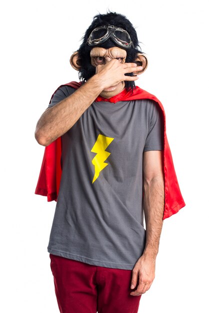 Free photo superhero monkey man making smelling bad gesture