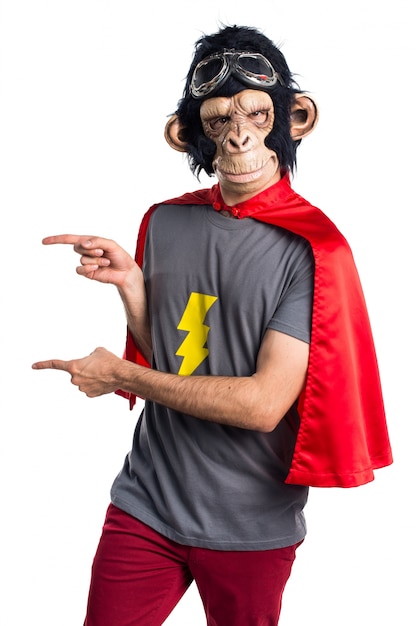 Free photo superhero monkey man pointing to the lateral