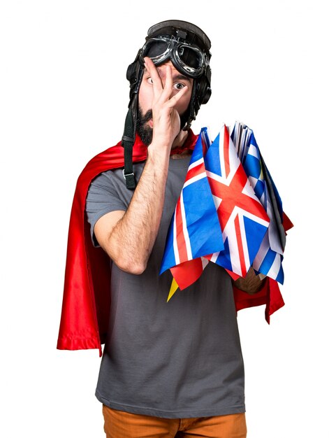 Superhero with a lot of flags making a joke