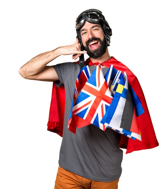 Superhero with a lot of flags making phone gesture