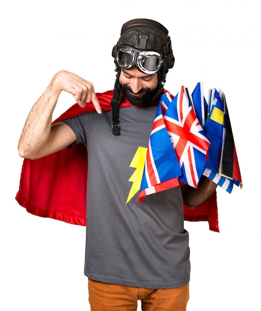 Free photo superhero with a lot of flags pointing down