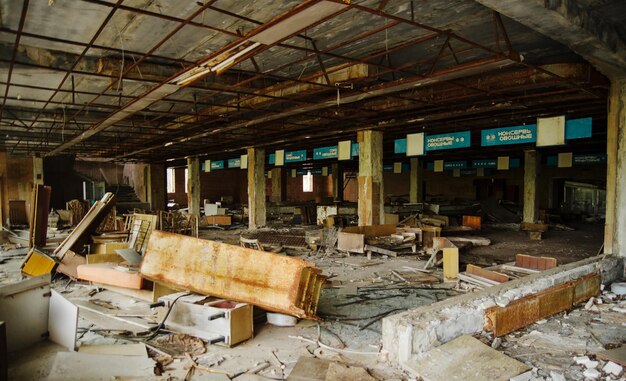 Supermarket shop at Chernobyl exclusion zone with ruins of abandoned pripyat city zone of radioactivity ghost town