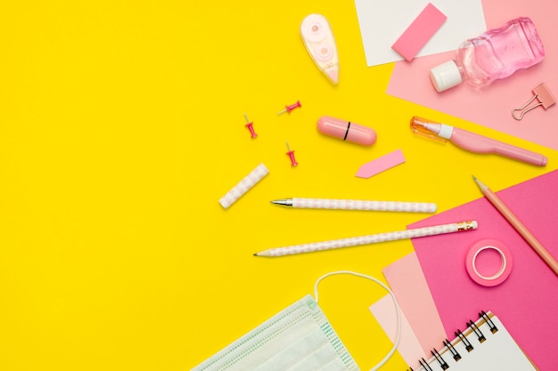 Supplies arrangement on yellow background