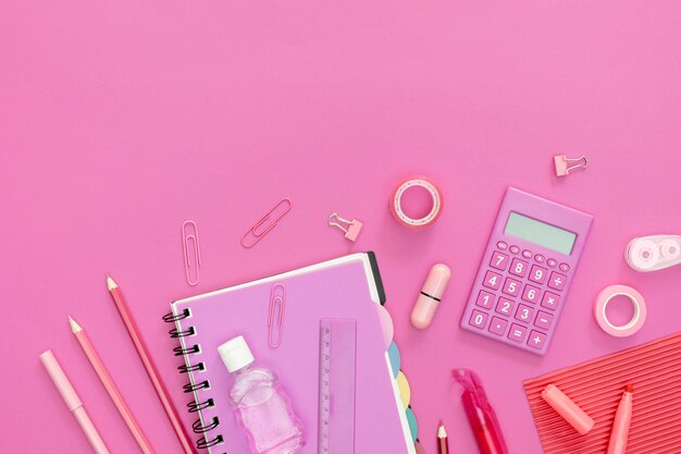 Supplies for school with pink background