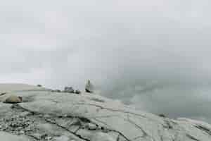 Free photo surface of rocky mountain with the stones in the fog