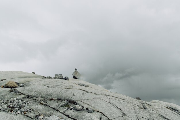 Surface of rocky mountain with the stones in the fog