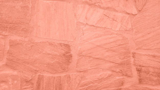 핑크 색조와 돌 담의 표면