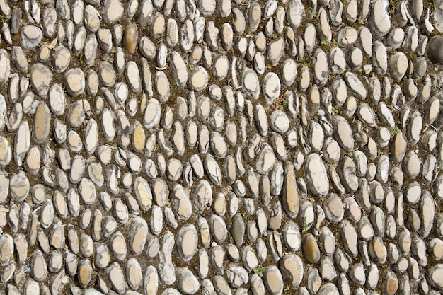 Surface of walking path laid with stones