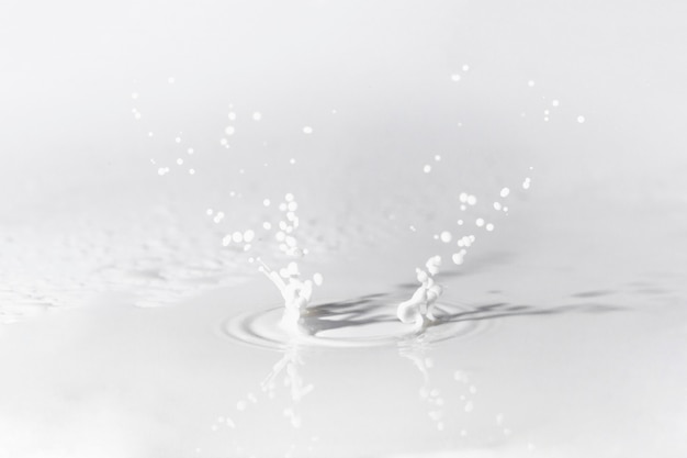 Free photo surface with milk splash and reflections