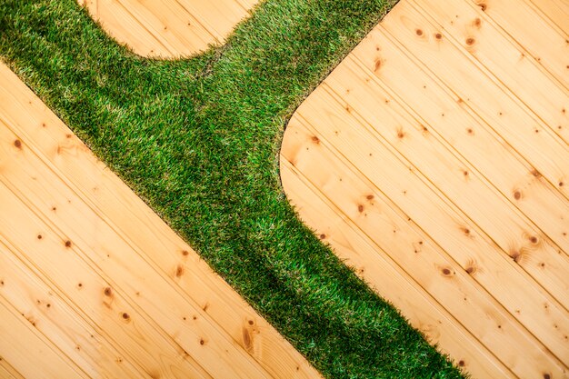 Surface with planks and grass