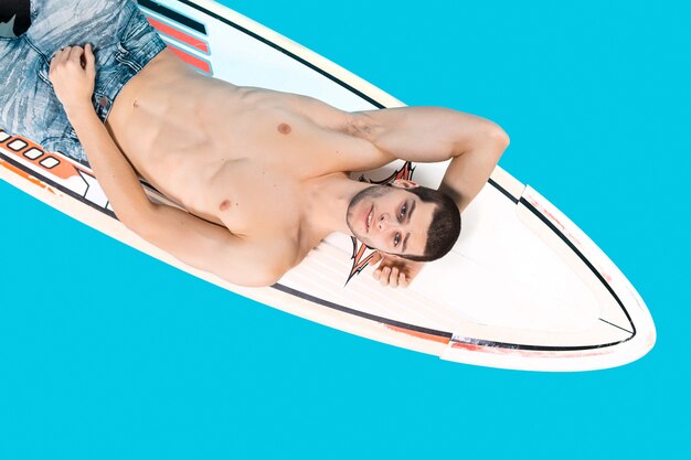 Surfer man posing 