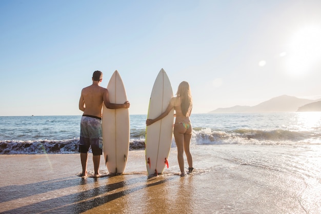 Surfers on cool pose