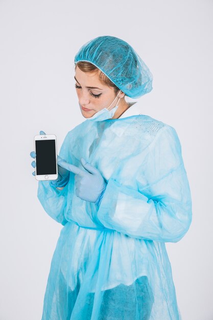 Surgeon pointing phone's screen