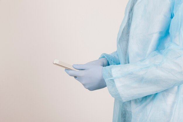 Surgeon's hands with the phone