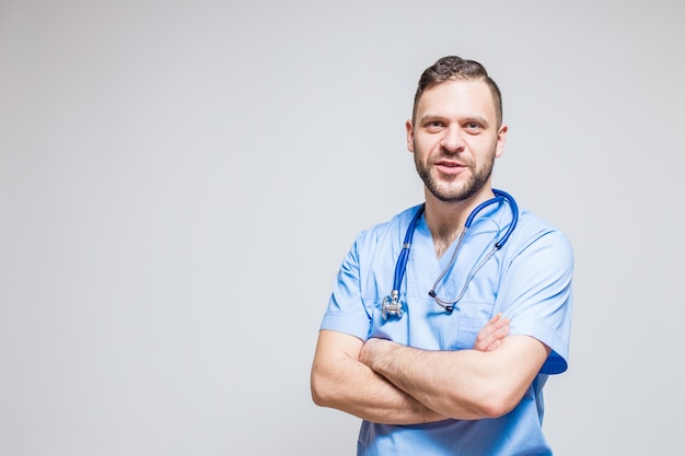 Surgeon with a stethoscope at the neck and arms crossed