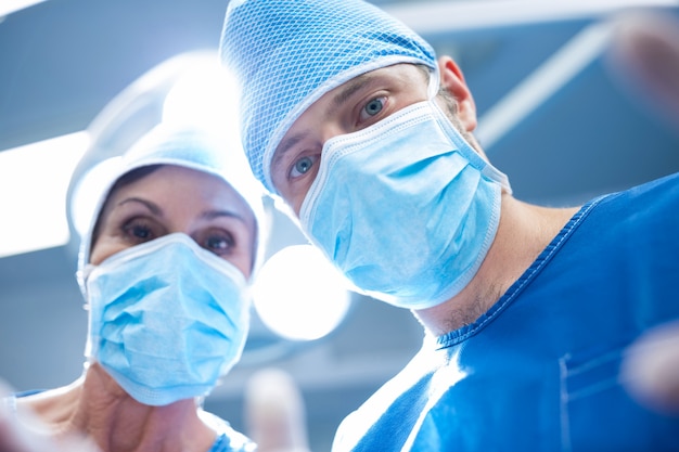 Surgeons performing operation in operation room