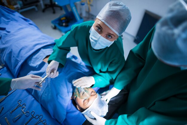 Surgeons performing operation in operation theater