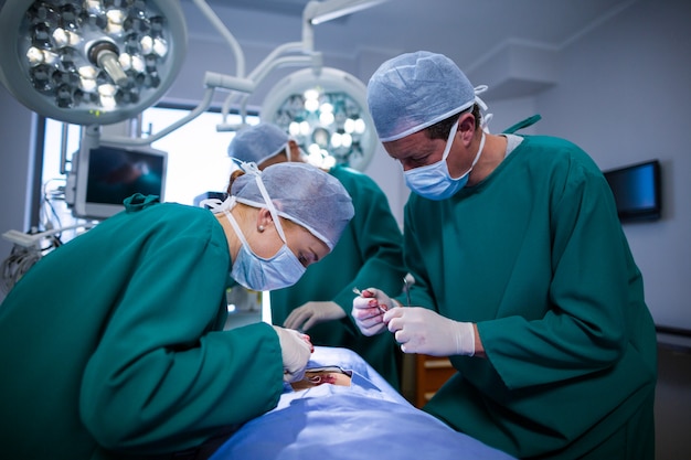 Surgeons performing operation in operation theater