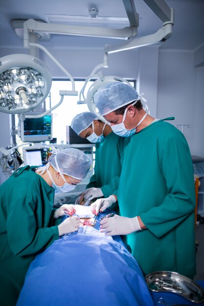 Surgeons performing operation in operation theater