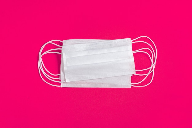 Free photo surgical mask over minimalist orange background