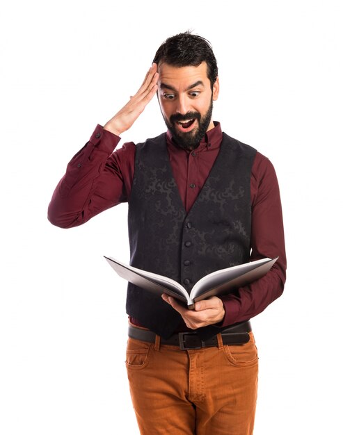 surprise man wearing waistcoat reading book