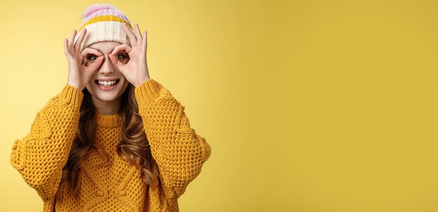 Surprised amused interested attractive young european woman wearing corduroy hat knitted sweater wid