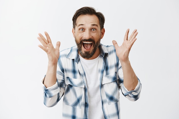 Free photo surprised bearded mature man posing