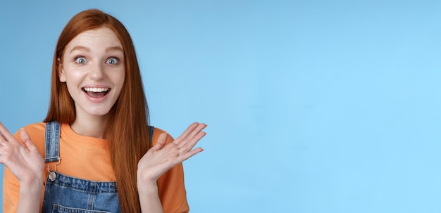 Free photo surprised delighted happy friendlylooking amused redhead female friend learn incredible good news