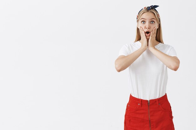Surprised and excited attractive girl hear amazing news