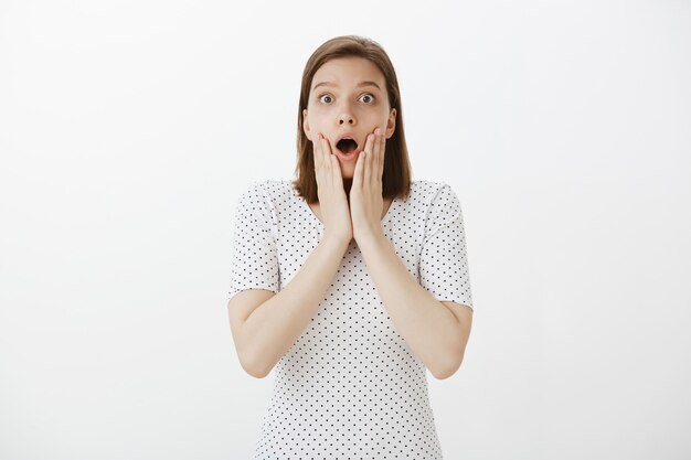 Surprised and excited woman find out amazing news, big announcement