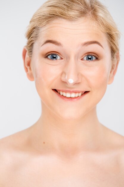 Surprised happy blond woman smiling