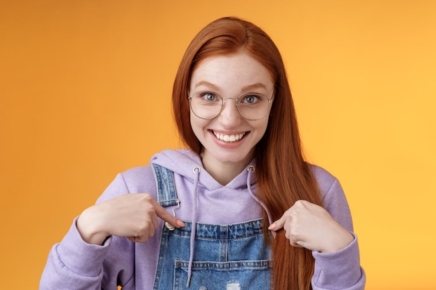 Surprised happy pleased happy smiling young redhead girl getting awesome proposal grinning questioned pointing herself laughing full disbelief receive promotion unbelievable chance