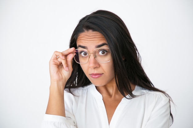 Surprised impressed woman looking at camera