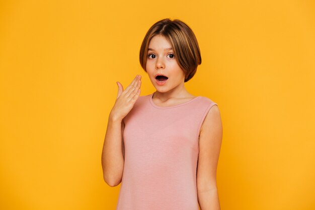 Surprised little lady looking camera isolated