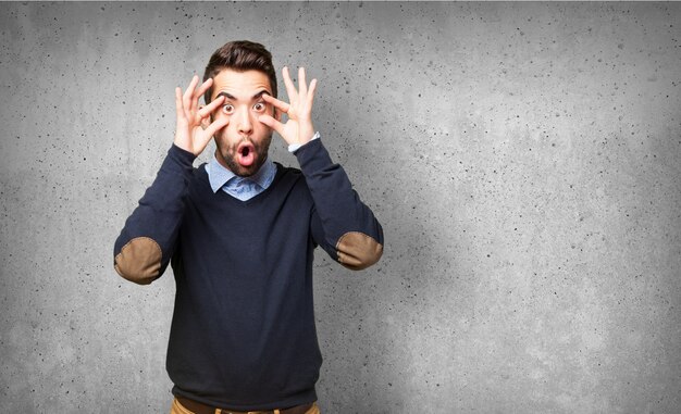 Surprised man in a gray background