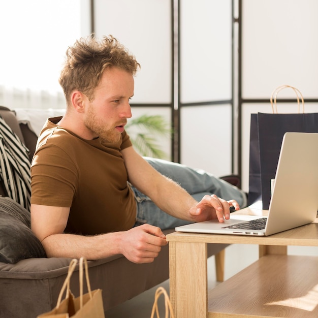 Surprised man looking at laptop